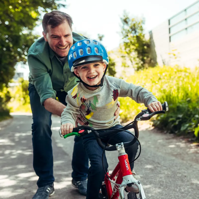 Child riding a woom bike